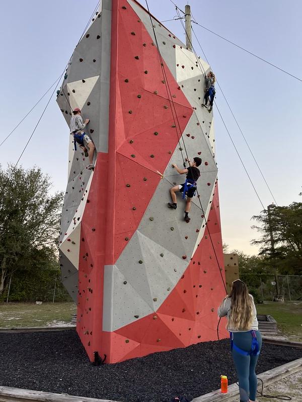 Students climbing the wall